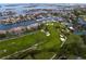 High-angle view featuring condos near a golf course and a marina in a waterside neighborhood with gorgeous landscaping at 2773 Seabreeze S Dr, Gulfport, FL 33707