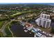 Captivating aerial shot of waterfront homes, pools, and a nearby golf course, offering a luxurious and active lifestyle at 2773 Seabreeze S Dr, Gulfport, FL 33707