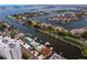 Expansive aerial view of waterfront homes and condos with private docks, offering scenic water access and resort-style living at 2773 Seabreeze S Dr, Gulfport, FL 33707