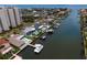 Aerial shot of waterfront homes with private pools and boat docks along a wide canal at 2773 Seabreeze S Dr, Gulfport, FL 33707