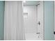 Bathroom features subway tile shower, updated fixtures, and a modern shower curtain at 2773 Seabreeze S Dr, Gulfport, FL 33707