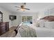 Inviting bedroom with a comfortable bed, soft lighting, and sliding glass doors offering a view of the pool at 2773 Seabreeze S Dr, Gulfport, FL 33707