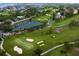 Picturesque aerial view of the golf course, with manicured greens, sand traps, and serene water features at 2773 Seabreeze S Dr, Gulfport, FL 33707