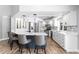 Bright kitchen features a breakfast bar, quartz countertops, stainless steel appliances, and ample storage space at 2773 Seabreeze S Dr, Gulfport, FL 33707