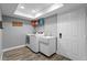 Bright laundry room with new washer and dryer and convenient sink at 2773 Seabreeze S Dr, Gulfport, FL 33707