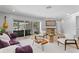 Inviting living room with stylish decor, including a wooden coffee table, plush seating, and natural lighting at 2773 Seabreeze S Dr, Gulfport, FL 33707