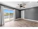 Main bedroom with an access to an outdoor porch with serene water views, and an ample closet space at 2773 Seabreeze S Dr, Gulfport, FL 33707