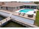 Beautiful waterfront home featuring a private pool, deck, and seating area with direct water access at 2773 Seabreeze S Dr, Gulfport, FL 33707