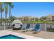 Serene pool deck with resort-style lounge chairs, covered seating, and waterfront views of the canal at 2773 Seabreeze S Dr, Gulfport, FL 33707