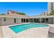 Private backyard oasis with a sparkling pool, spacious deck, and seamless indoor-outdoor living at 2773 Seabreeze S Dr, Gulfport, FL 33707