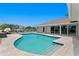 Inviting pool area with large travertine deck, perfect for enjoying the Florida sunshine and waterfront lifestyle at 2773 Seabreeze S Dr, Gulfport, FL 33707