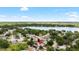 Lovely aerial view of the community with a lake and lush greenery, showcasing the neighborhood at 2807 Northcote Dr, Palm Harbor, FL 34684
