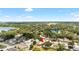A picturesque aerial view of the neighborhood, featuring beautiful houses surrounded by trees at 2807 Northcote Dr, Palm Harbor, FL 34684