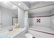 Bathroom features a tub, shower, sink, toilet, tile backsplash, and a decorative theme at 2807 Northcote Dr, Palm Harbor, FL 34684