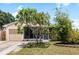 Inviting single-story home featuring a screened porch and well-maintained landscaping at 2807 Northcote Dr, Palm Harbor, FL 34684