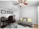Cozy home office space featuring a ceiling fan, stylish rug, desk, and comfortable seating area at 2807 Northcote Dr, Palm Harbor, FL 34684