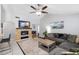 Comfortable living room with vaulted ceilings, stylish decor, and an eye-catching media center at 2807 Northcote Dr, Palm Harbor, FL 34684