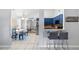 Open-concept living space showcasing the dining area, breakfast bar, and modern kitchen at 2807 Northcote Dr, Palm Harbor, FL 34684