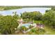 A refreshing community pool area complete with a playground and lush landscaping at 2807 Northcote Dr, Palm Harbor, FL 34684