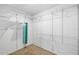 Spacious walk-in closet with extensive shelving and storage options for organized living at 2807 Northcote Dr, Palm Harbor, FL 34684