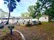 Spacious backyard with pool, shed, gazebo, and raised garden beds at 3143 Phoenix Ave, Oldsmar, FL 34677