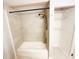 Clean bathroom featuring a tiled shower, tub, and built in storage shelving at 3143 Phoenix Ave, Oldsmar, FL 34677