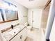 Updated bathroom with granite vanity, modern fixtures, and tiled shower and floors at 3143 Phoenix Ave, Oldsmar, FL 34677