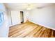 Bedroom featuring wood floors, ample natural light, and closet with sliding doors at 3143 Phoenix Ave, Oldsmar, FL 34677