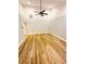 This spacious bedroom includes new floors and a ceiling fan at 3143 Phoenix Ave, Oldsmar, FL 34677