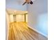 This room has hardwood floors and access to multiple rooms at 3143 Phoenix Ave, Oldsmar, FL 34677