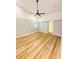 Bedroom showcasing wood floors, natural light, and a ceiling fan at 3143 Phoenix Ave, Oldsmar, FL 34677