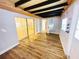Bedroom with hardwood floors, sliding door closet, and multiple windows at 3143 Phoenix Ave, Oldsmar, FL 34677