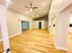 Spacious living room features vaulted ceilings, wood floors, ceiling fans and lots of natural light at 3143 Phoenix Ave, Oldsmar, FL 34677