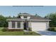 Charming single-story home with modern design, featuring a two-car garage and beautifully landscaped front yard at 318 Holly Bank Ave, Nokomis, FL 34275