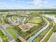 Beautiful aerial showcasing community amenities, including a playground, waterways, and lush green spaces at 33750 Ocean Spray Ln, Wesley Chapel, FL 33543