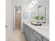 Contemporary bathroom with double sinks, quartz countertop, and modern fixtures at 33750 Ocean Spray Ln, Wesley Chapel, FL 33543