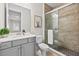 Contemporary bathroom featuring a glass-enclosed shower and modern vanity at 33750 Ocean Spray Ln, Wesley Chapel, FL 33543