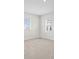 Well-lit bedroom with neutral tones and two windows providing natural light at 33750 Ocean Spray Ln, Wesley Chapel, FL 33543