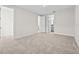 Expansive bedroom with soft carpeting and multiple doorways leading to other rooms at 33750 Ocean Spray Ln, Wesley Chapel, FL 33543