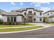 Beautiful two-story home with a stone accent wall, a two-car garage, and lovely landscaping in the front yard at 33750 Ocean Spray Ln, Wesley Chapel, FL 33543