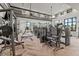 Bright gym featuring state-of-the-art weightlifting equipment and large windows for a comfortable workout at 33750 Ocean Spray Ln, Wesley Chapel, FL 33543
