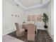 Cozy home office with neutral walls, trey ceilings and comfortable seating at 33750 Ocean Spray Ln, Wesley Chapel, FL 33543
