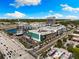 Aerial view of the neighborhood with commercial and residential buildings in a vibrant city at 3702 W Cass St # 5, Tampa, FL 33609
