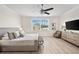 Cozy bedroom featuring neutral tones, a ceiling fan, and a comfortable king-sized bed at 3702 W Cass St # 5, Tampa, FL 33609
