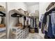 Organized walk-in closet with shelves, hanging rods, and shoe storage at 3702 W Cass St # 5, Tampa, FL 33609
