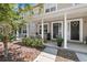 Townhouse exterior with a covered front porch and well-maintained landscaping at 3702 W Cass St # 5, Tampa, FL 33609
