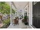 Charming townhouse porch with comfortable seating and view of the exterior at 3702 W Cass St # 5, Tampa, FL 33609