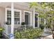 Townhouse exterior view with outdoor seating on the front porch at 3702 W Cass St # 5, Tampa, FL 33609