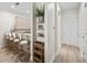 Hallway view leading to a bright kitchen with breakfast bar seating at 3702 W Cass St # 5, Tampa, FL 33609