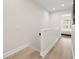 Light-filled hallway with wood flooring leading to a bedroom with natural light at 3702 W Cass St # 5, Tampa, FL 33609